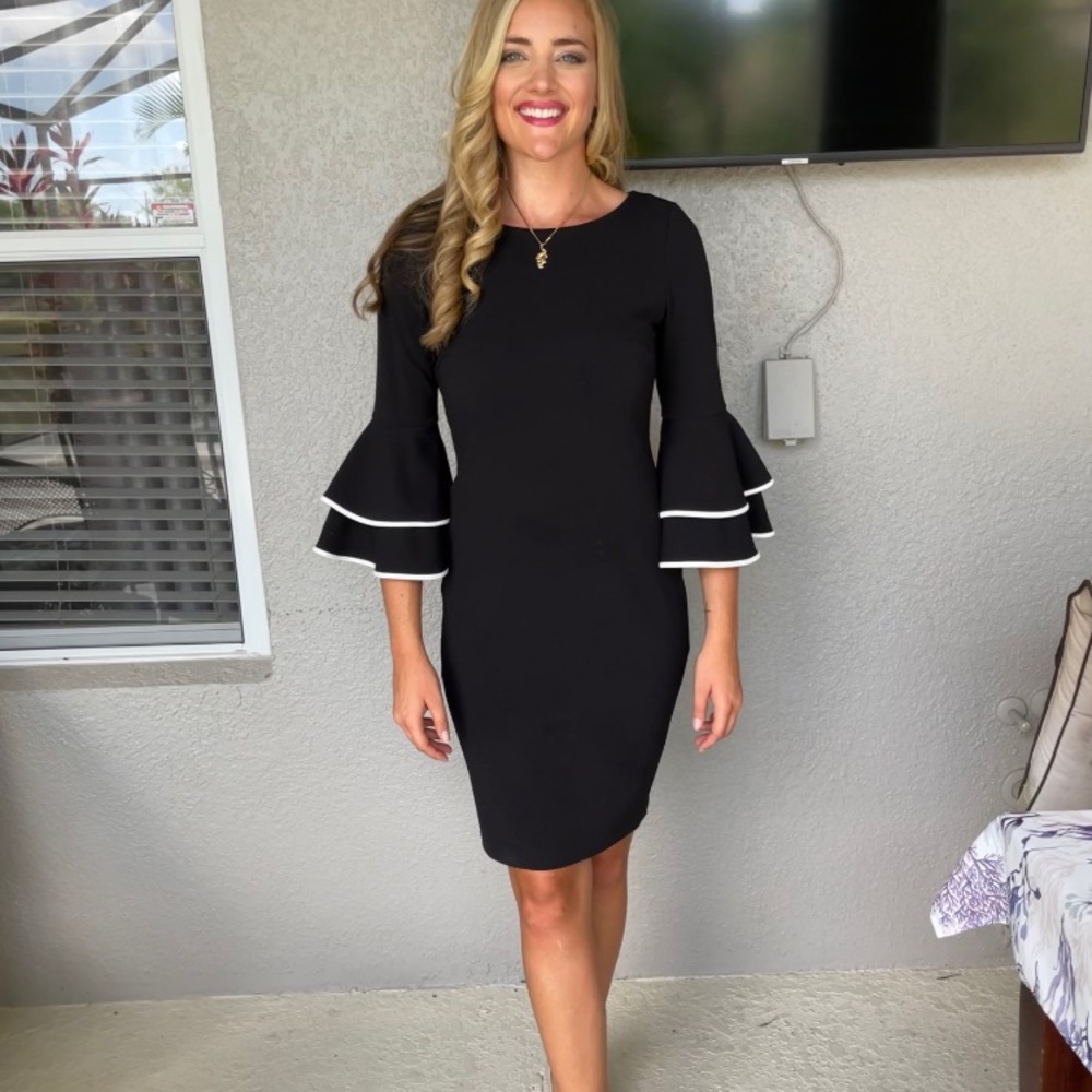 Black dress with white detail on sleeves